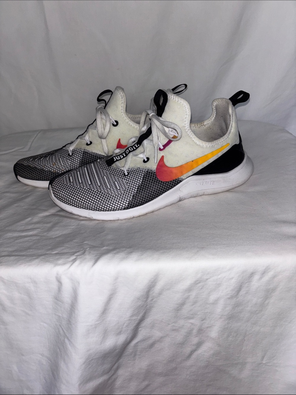Women’s Nike Free White and Black Athletic Sneakers with Pink Accent